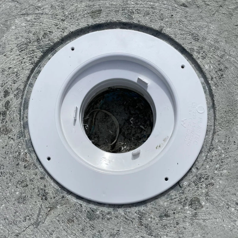 PVC puddle flange installed flush into a recessed concrete slab