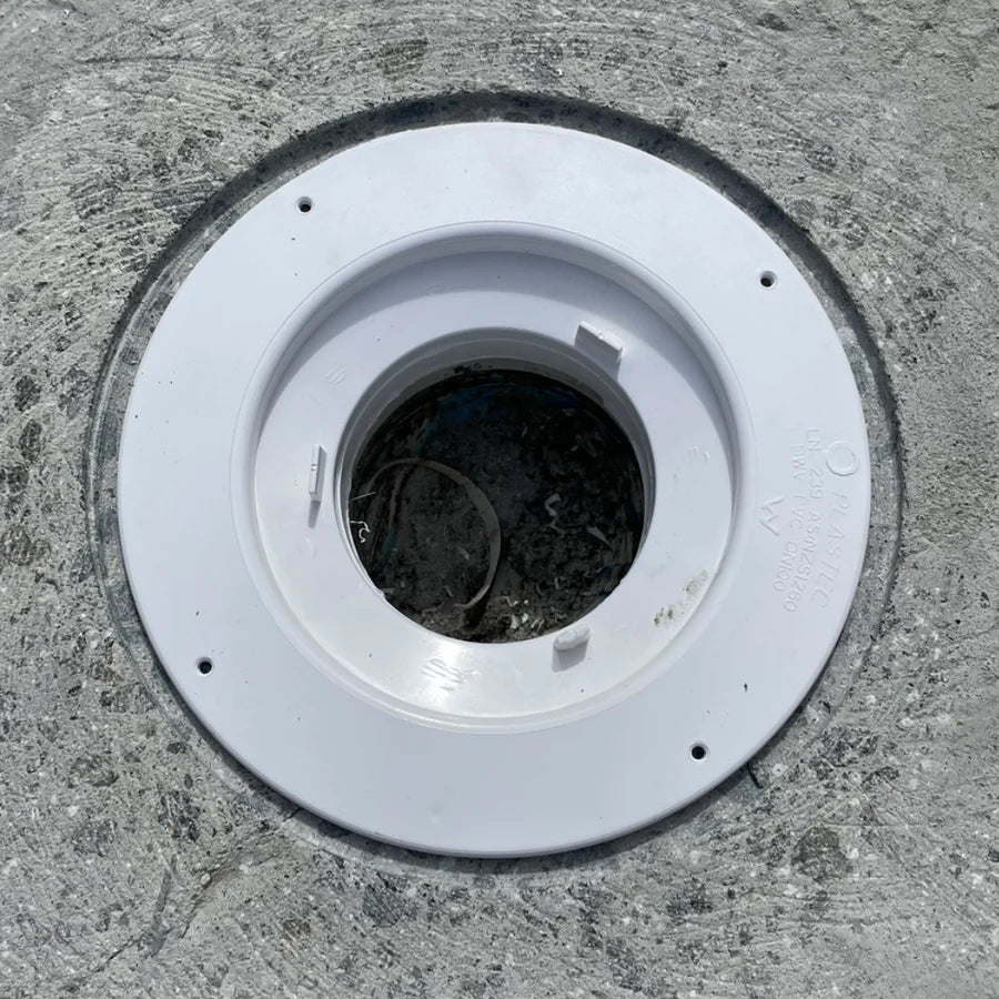 PVC puddle flange installed flush into a recessed concrete slab